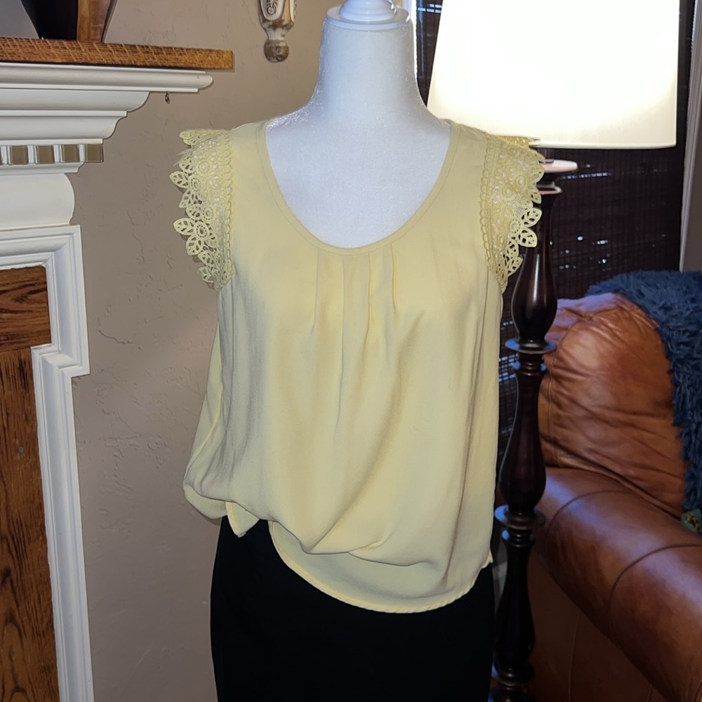 Mine pale yellow sleeveless blouse